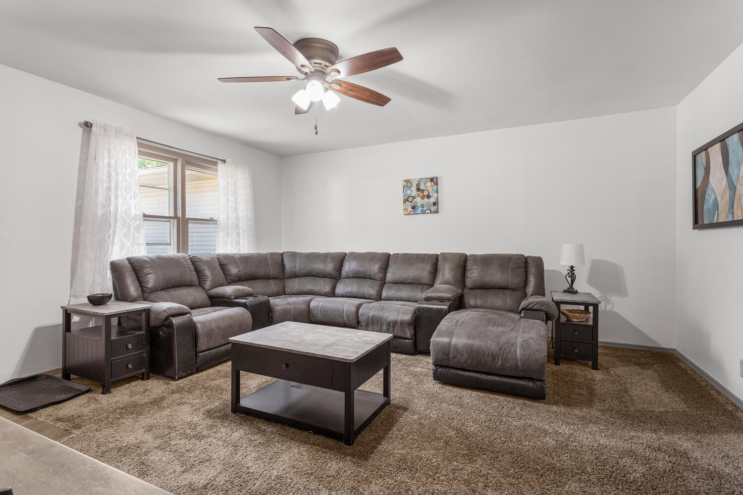 2305 East Shurts Circle Urbana, IL 61801 - Photo 4 of 26 a living room with furniture and a chandelier