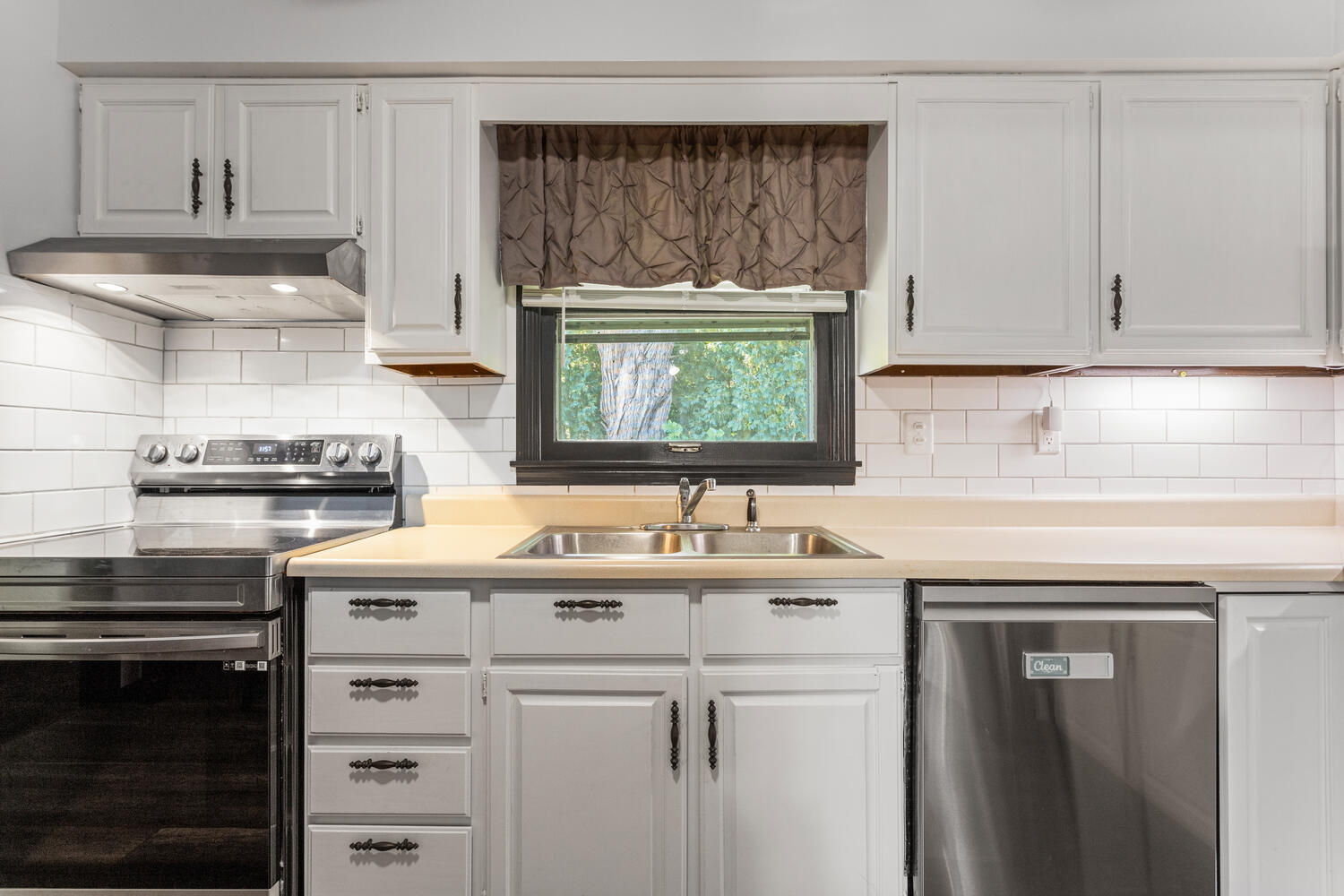 2305 East Shurts Circle Urbana, IL 61801 - Photo 9 of 26 a kitchen with a sink stove and cabinets