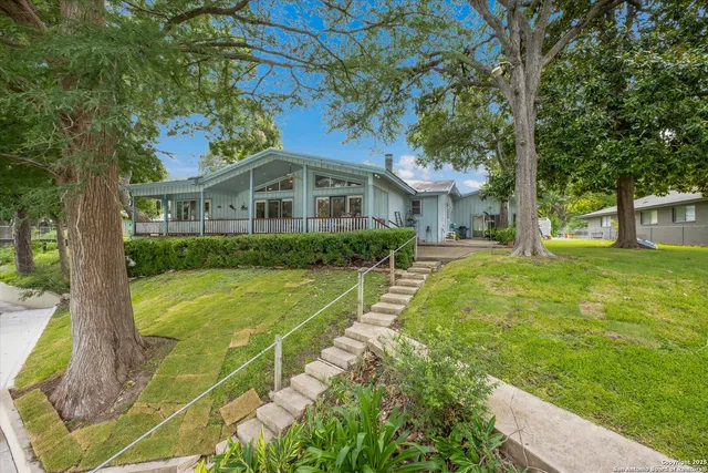 a front view of a house with yard