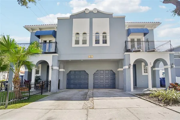 a front view of a house with parking
