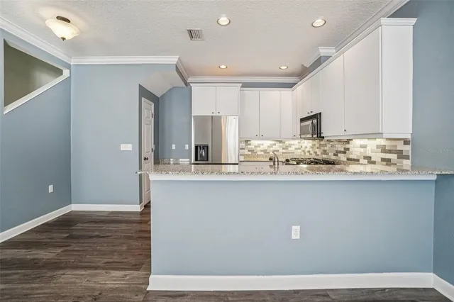 a view of kitchen island wooden floor