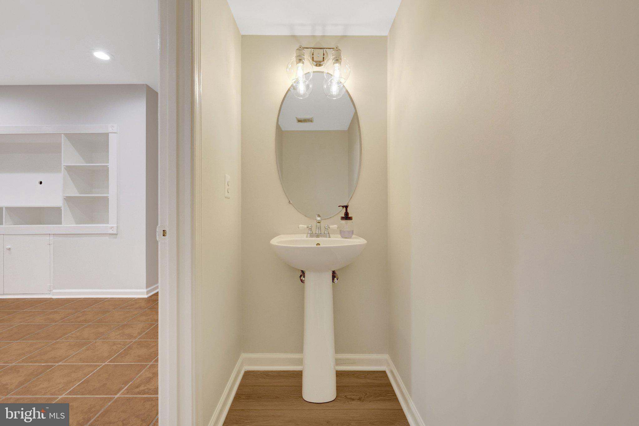 1268 Wild Hawthorn Way Reston, VA 20194 - Photo 44 of 55 2nd Powder Room w/ New Fixture & Flooring