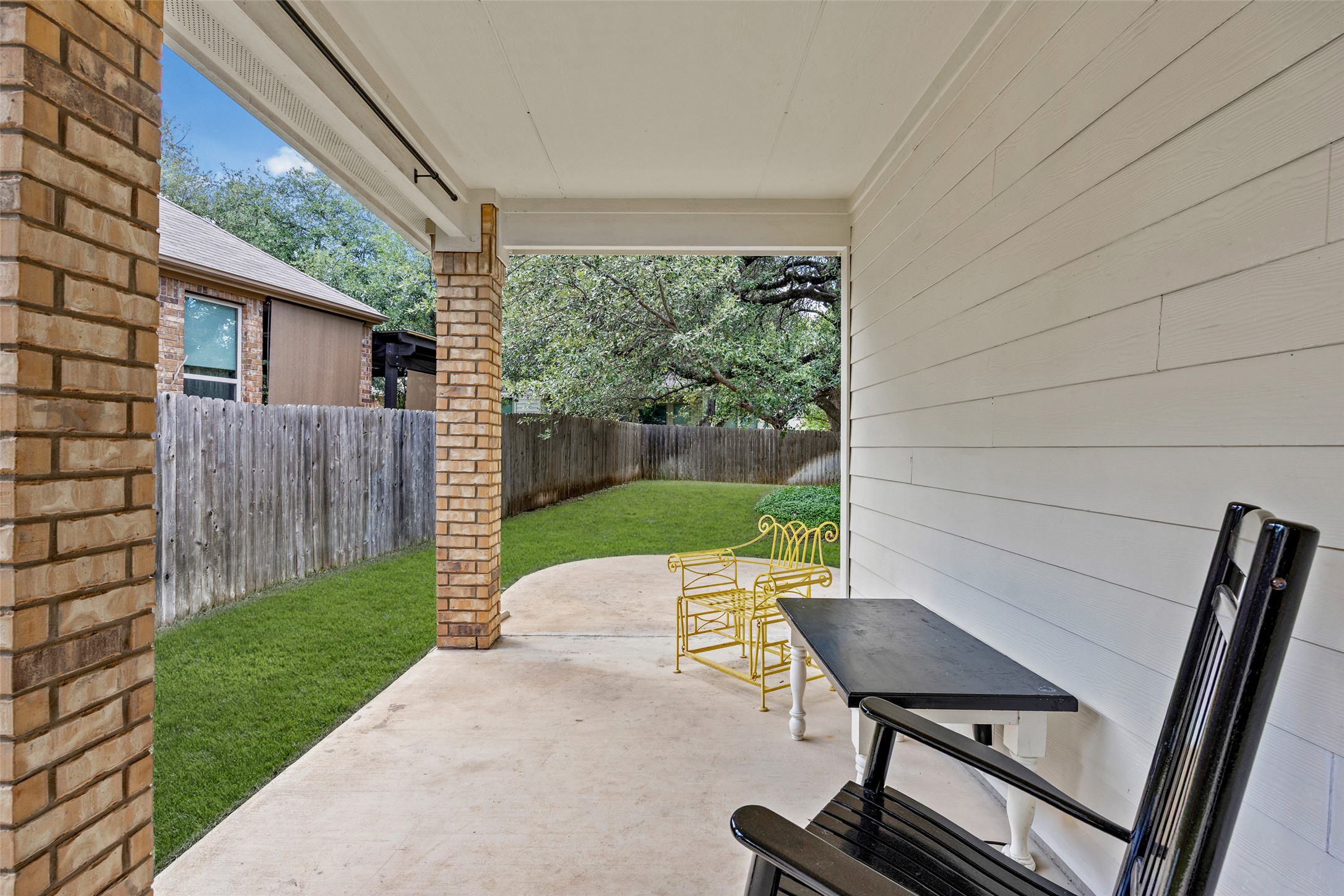 3451 Mayfield Ranch Boulevard, Unit 201 Round Rock, TX 78681 - Photo 29 of 29 a view of backyard with seating space and wooden fence