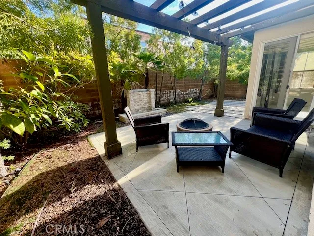 a bedroom with furniture and large windows