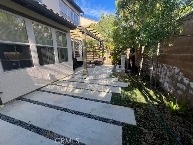 a view of yard along with road and trees