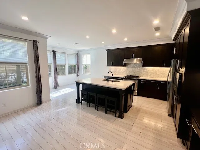 a kitchen with a table and chairs in it