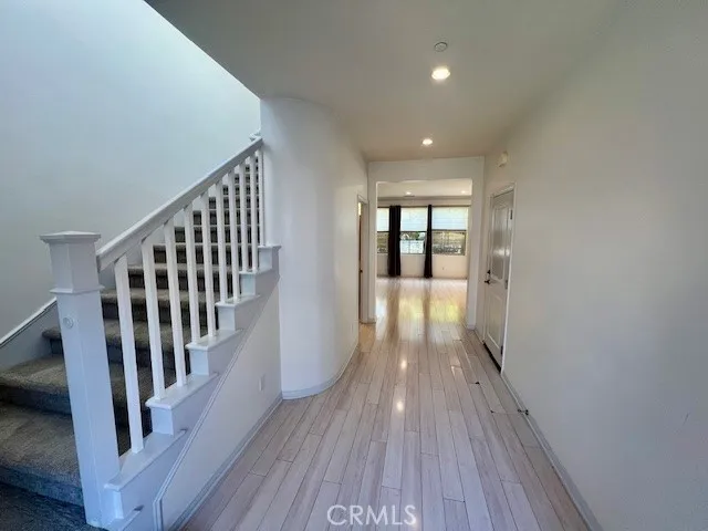 a view of gallery with wooden floor