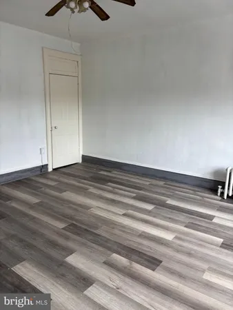 a view of room and wooden floor