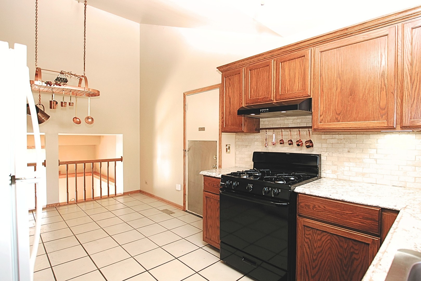1151 Sandpebble Circle Algonquin, IL 60102 - Photo 13 of 34 a kitchen with granite countertop a stove and a cabinets