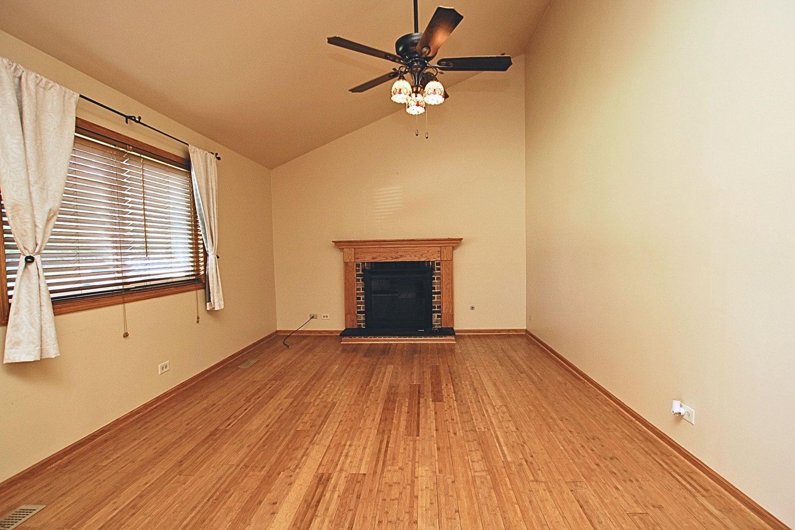 1151 Sandpebble Circle Algonquin, IL 60102 - Photo 15 of 34 a view of an empty room with a window and a fireplace