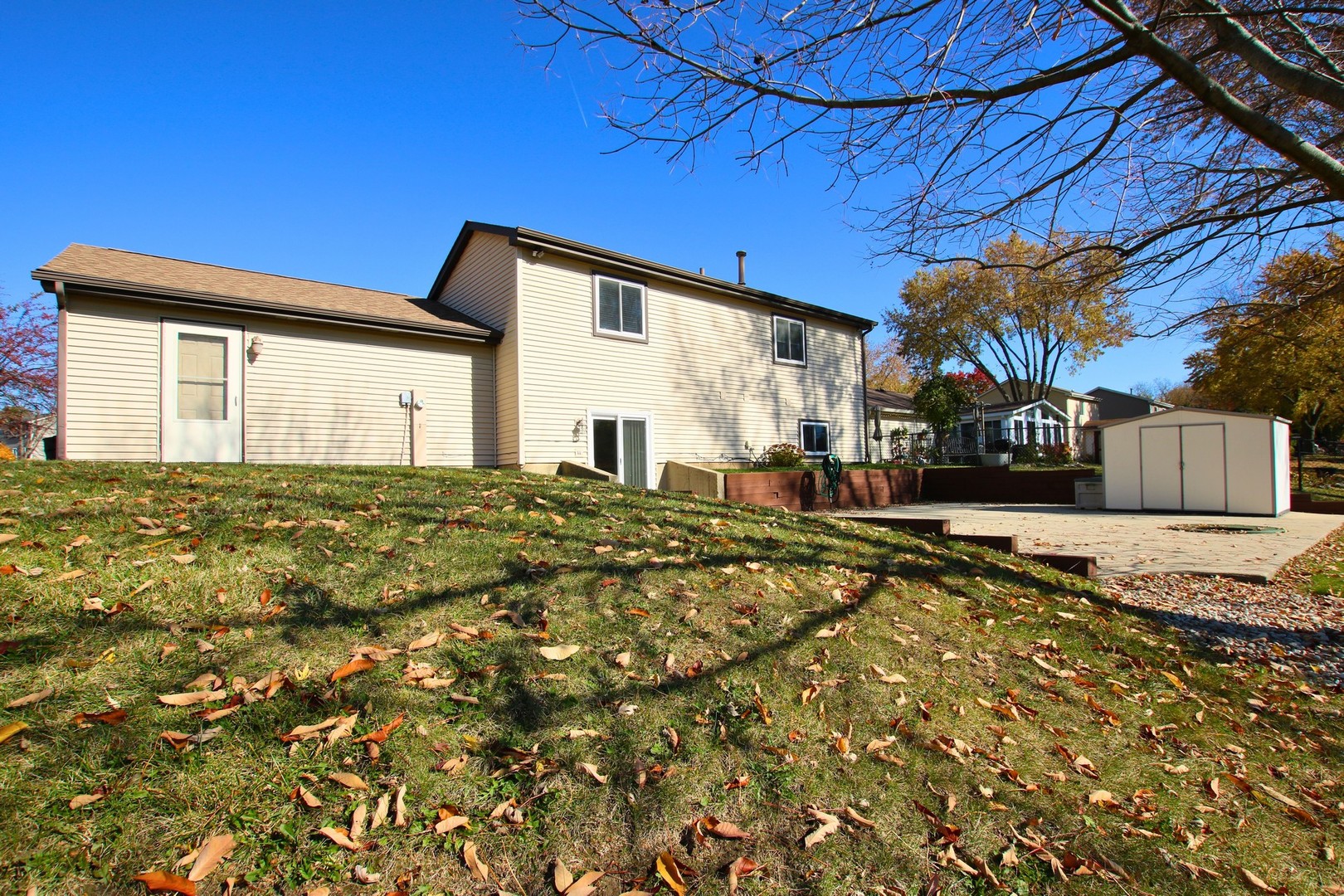 1151 Sandpebble Circle Algonquin, IL 60102 - Photo 26 of 34 a view of a house with a yard