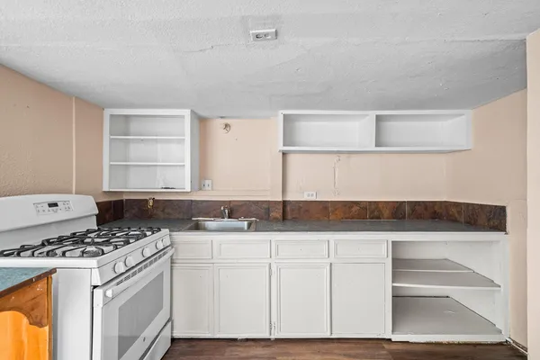 a view of kitchen with wooden floor