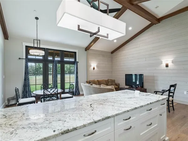 a kitchen with stainless steel appliances a sink and a stove
