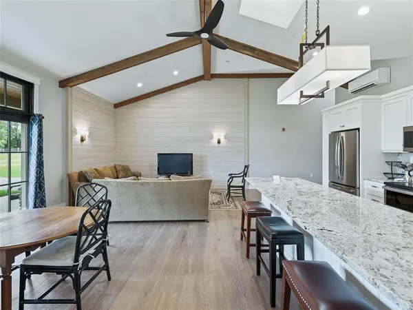 a view of a patio with table and chairs and potted plants