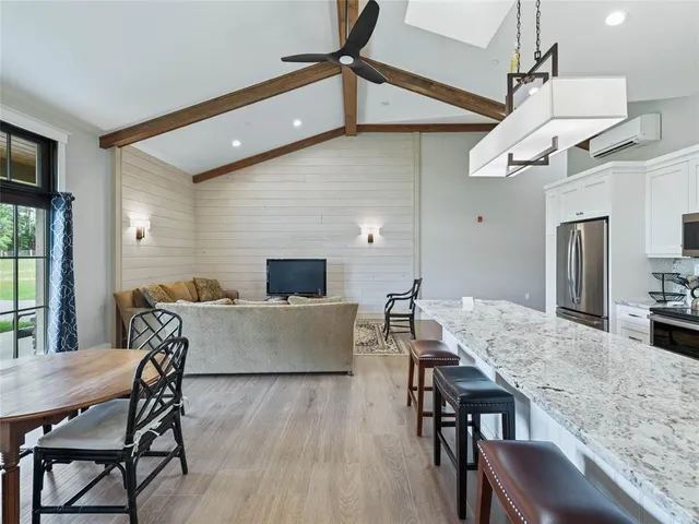 a view of a patio with table and chairs and potted plants