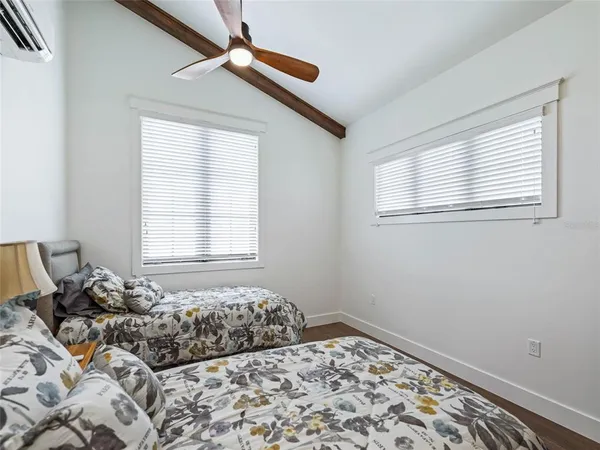 a view of a porch with furniture and a yard