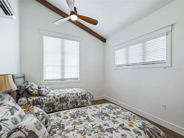 a view of a porch with furniture and a yard