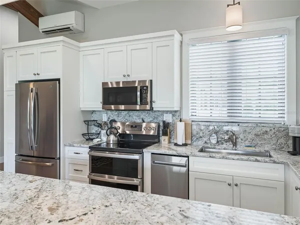 a bed room with furniture and a table