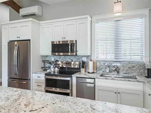 a bed room with furniture and a table