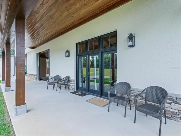 a front view of a house with a yard and porch