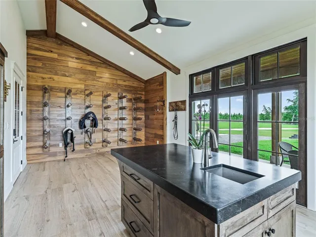 a aerial view of a house with swimming pool and a yard