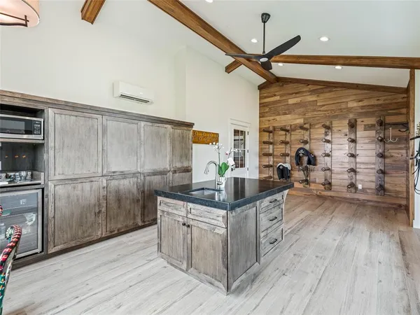 an aerial view of a house with a big yard