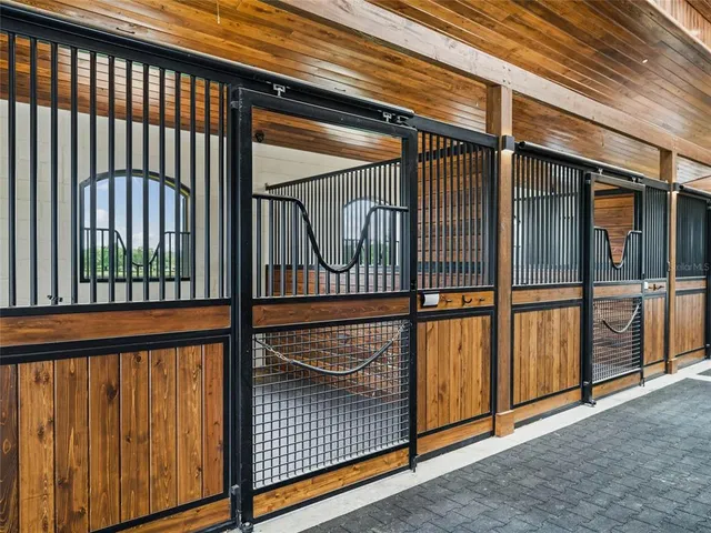 a view of swimming pool with brick walls