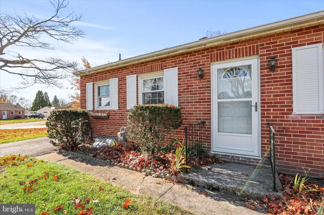 a front view of house with yard outdoor seating and barbeque oven