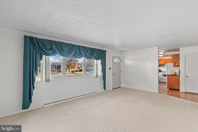 a view of an empty room and window