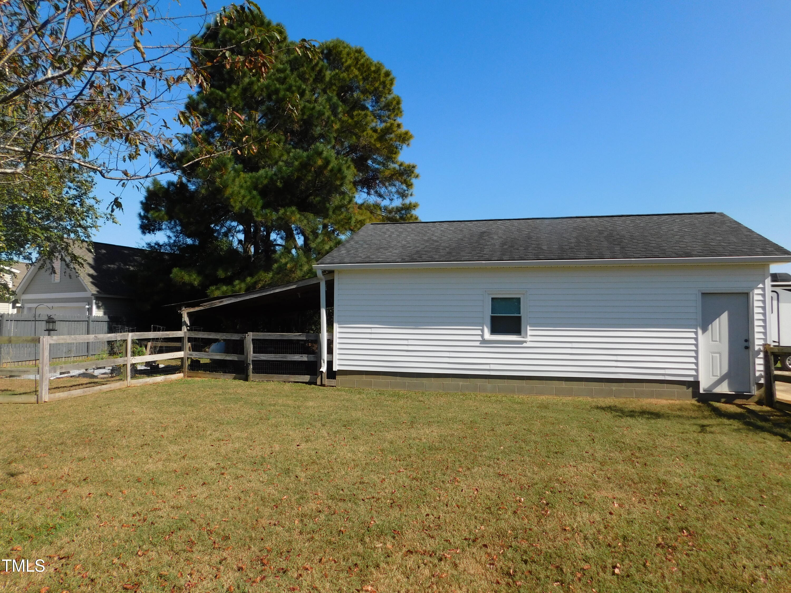 1168 Earpsboro Road Zebulon, NC 27597 - Photo 14 of 25 a view of a swimming pool with an outdoor space and seating area