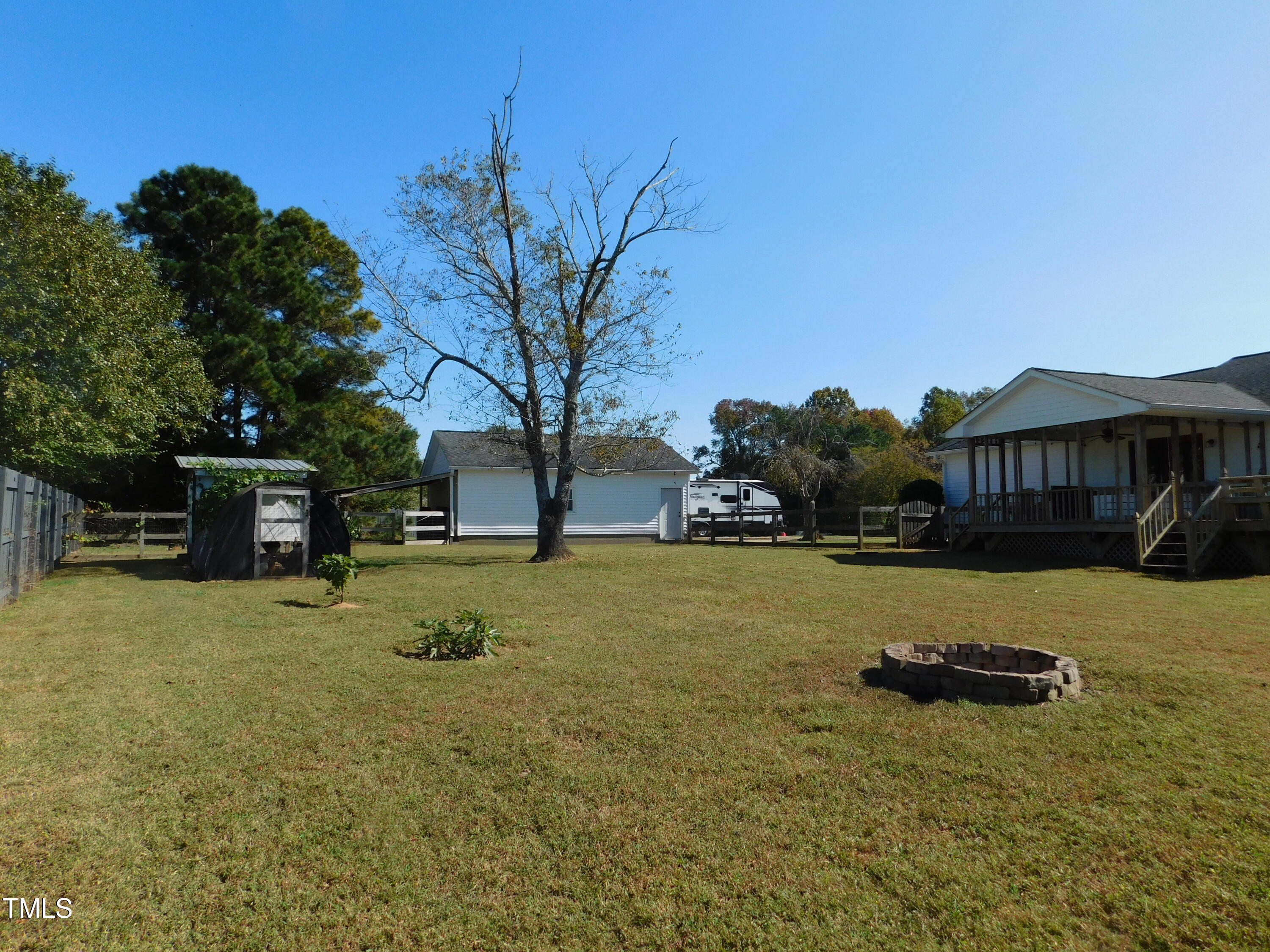 1168 Earpsboro Road Zebulon, NC 27597 - Photo 17 of 25 a front view of house with yard and trees