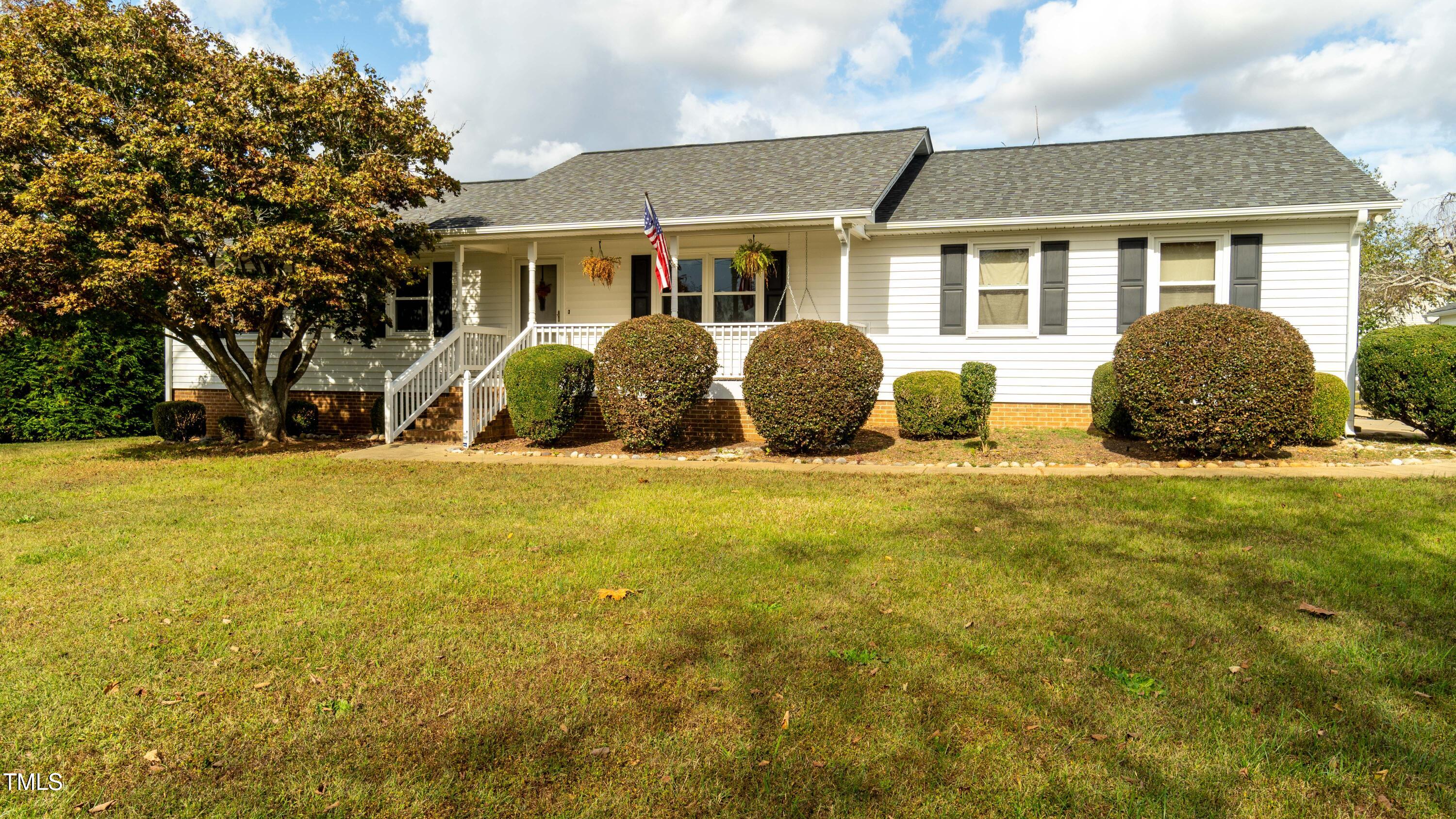 1168 Earpsboro Road Zebulon, NC 27597 - Photo 2 of 25 a front view of house with yard and trees around