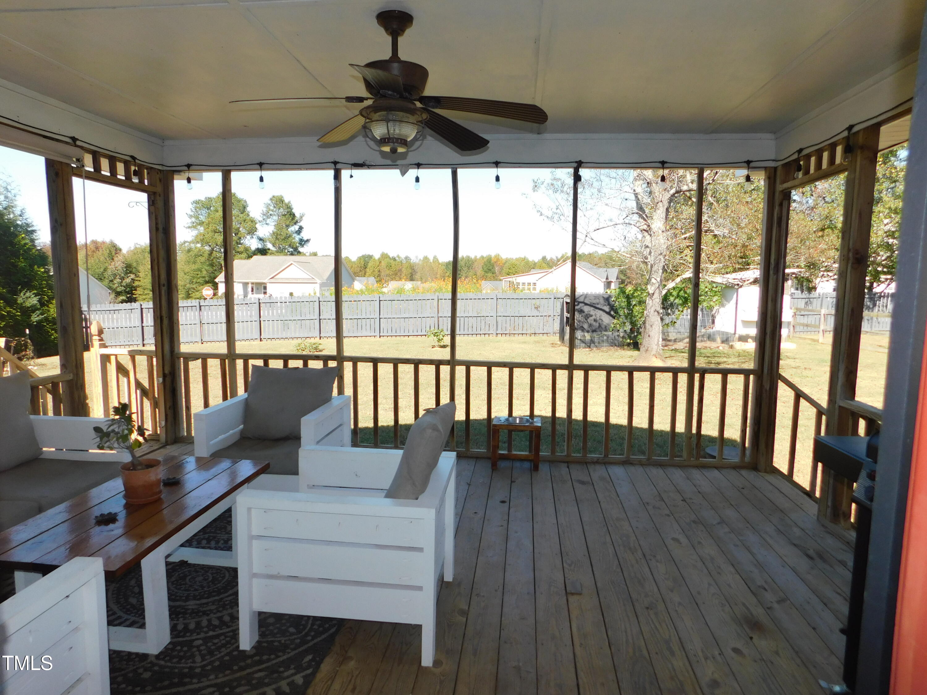 1168 Earpsboro Road Zebulon, NC 27597 - Photo 24 of 25 a living room with large windows