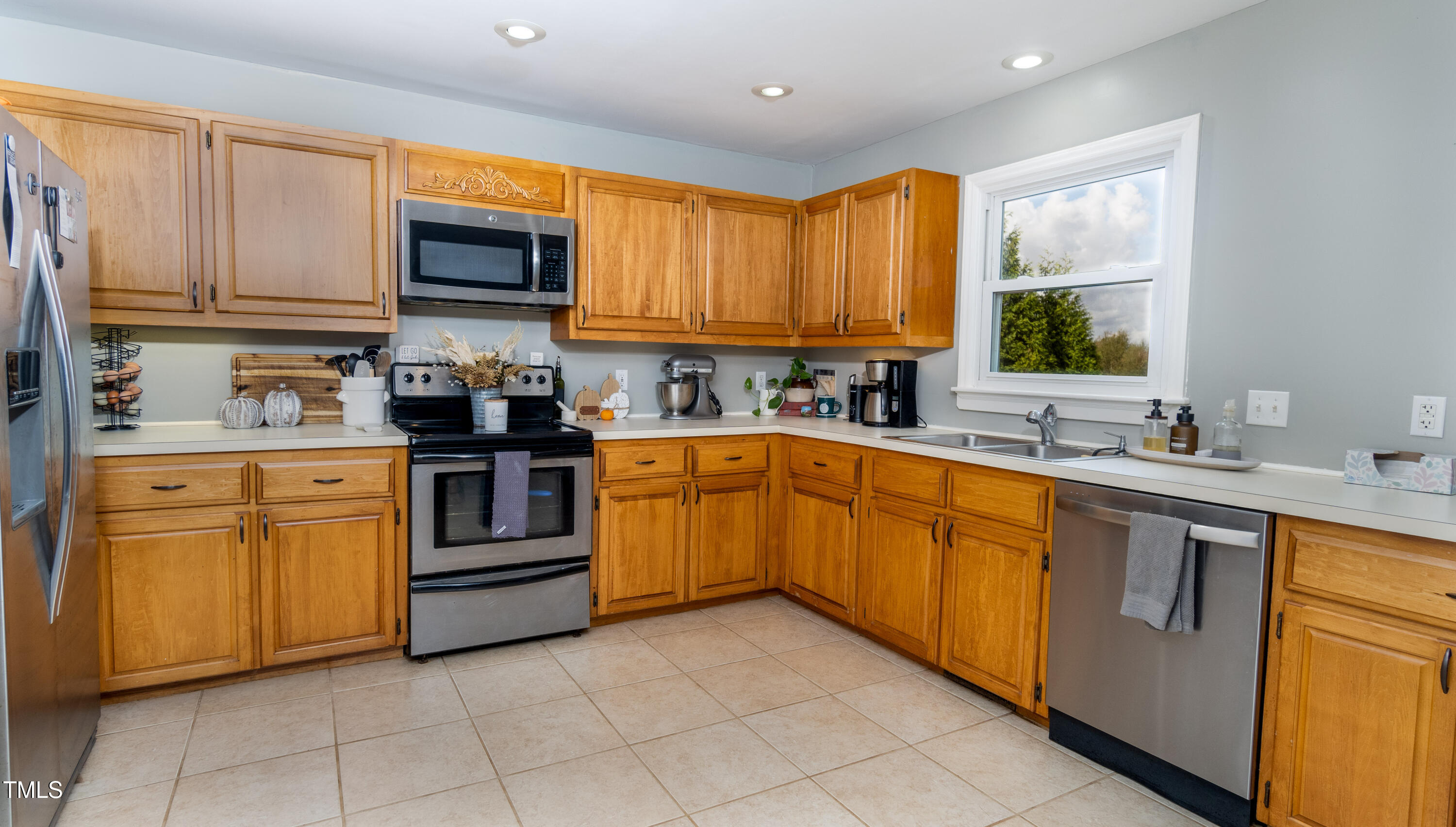 1168 Earpsboro Road Zebulon, NC 27597 - Photo 7 of 25 a kitchen with stainless steel appliances granite countertop a sink and cabinets