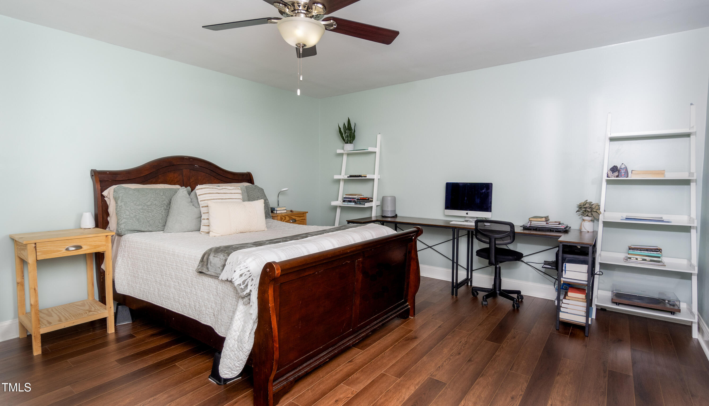 1168 Earpsboro Road Zebulon, NC 27597 - Photo 10 of 25 a bedroom with a bed and a flat screen tv