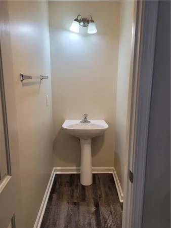 a bathroom with a sink toilet