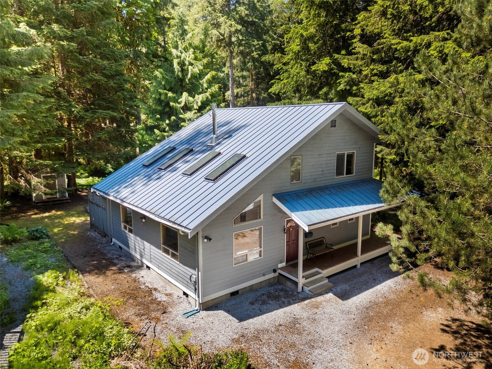7101 Rainier Way Glacier, WA 98244 - Photo 1 of 40 a view of a house with a yard balcony and wooden fence