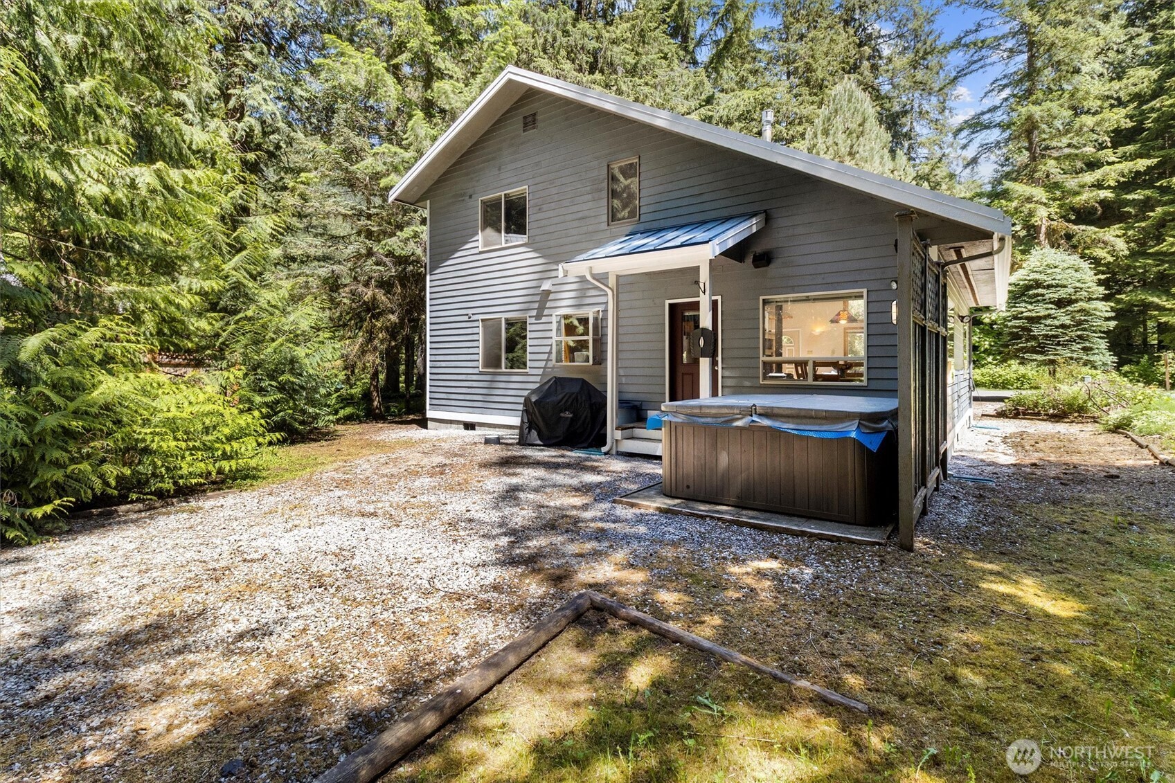 7101 Rainier Way Glacier, WA 98244 - Photo 28 of 40 a view of a house with a yard and sitting area