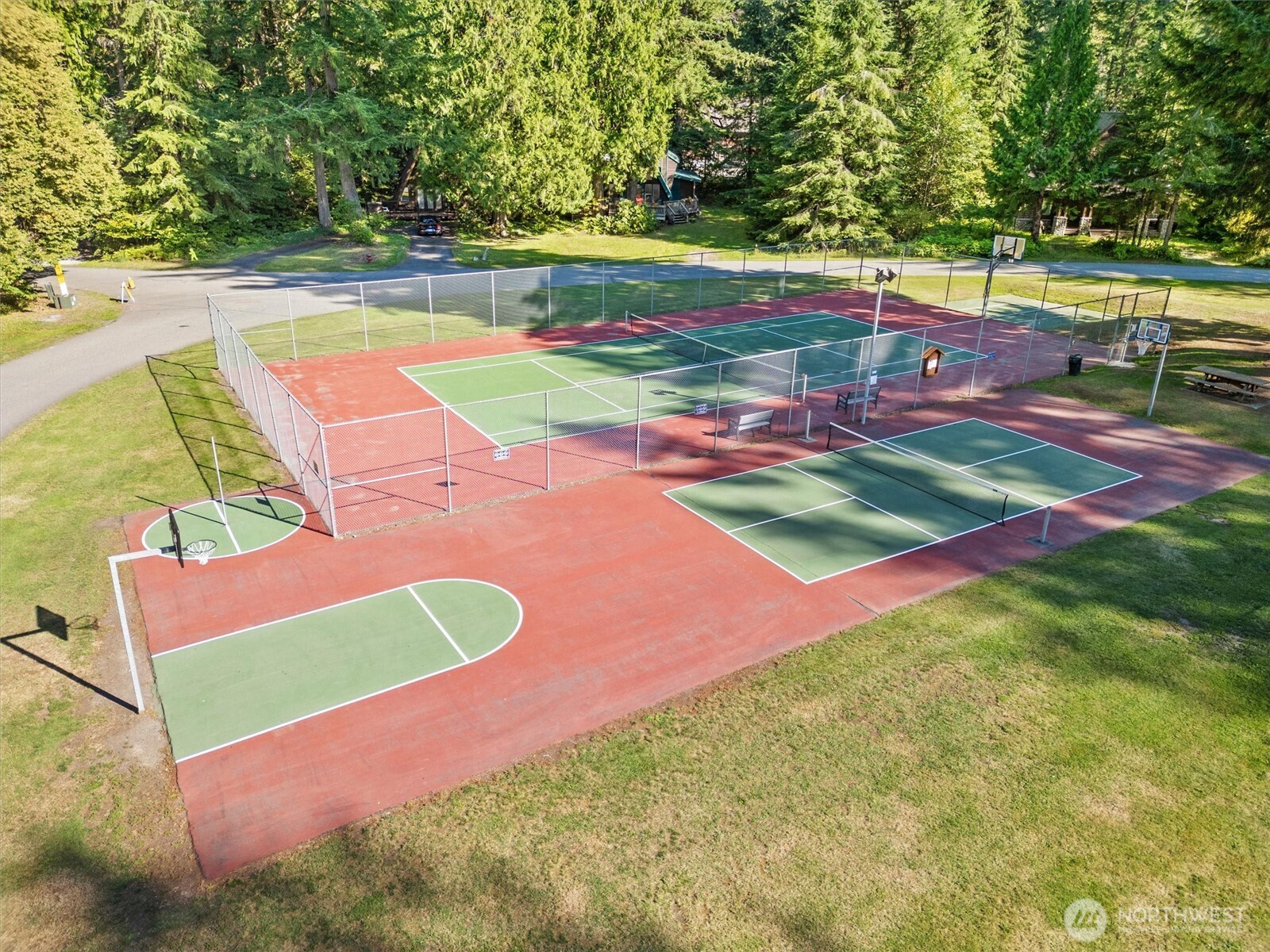 7101 Rainier Way Glacier, WA 98244 - Photo 37 of 40 a view of a tennis ground with large trees