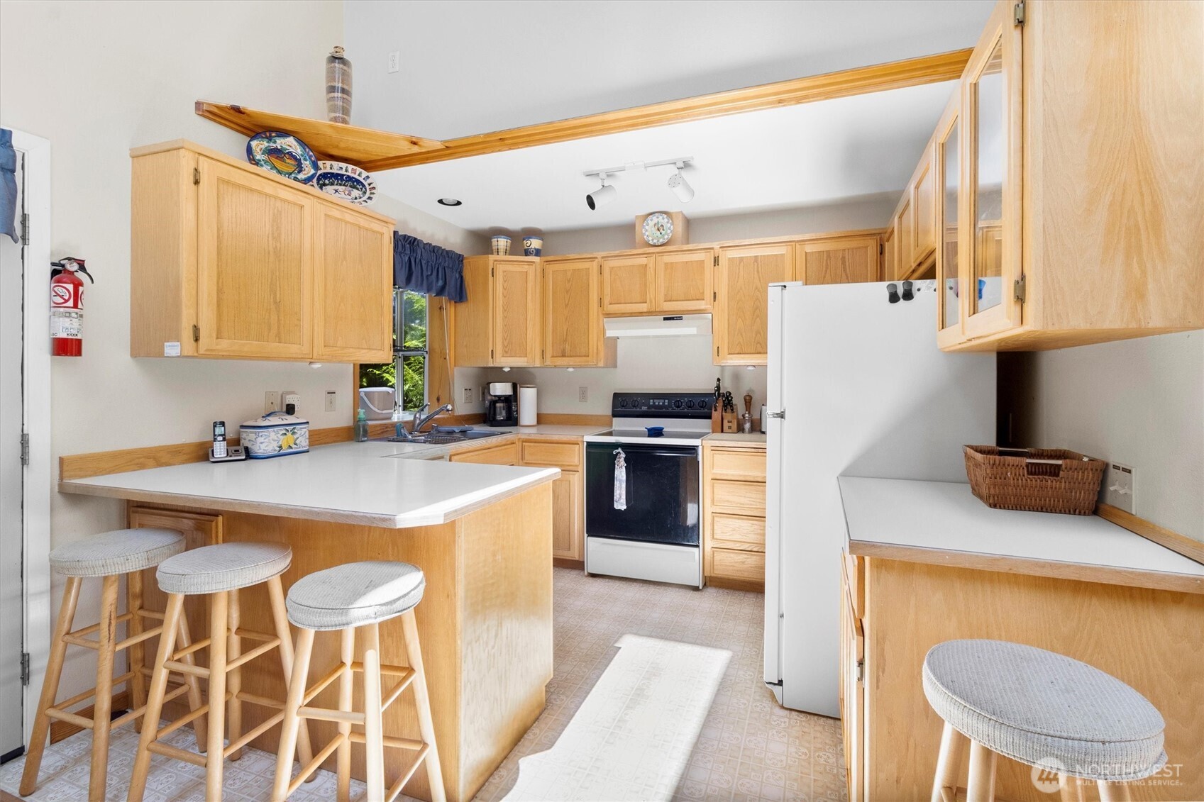 7101 Rainier Way Glacier, WA 98244 - Photo 10 of 40 a kitchen with granite countertop a sink stainless steel appliances and cabinets
