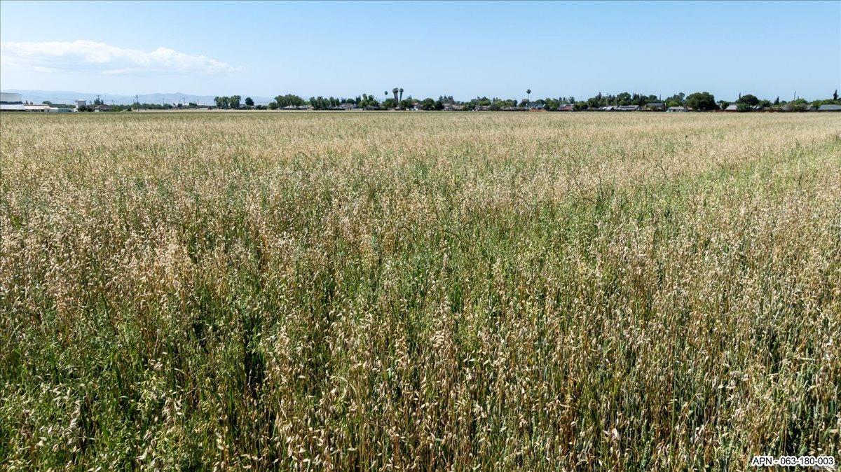 0 South Mills Road Gustine, CA 95322 - Photo 17 of 24 a view of a lake with a city in the background