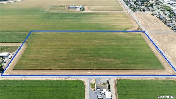 an aerial view of a houses with a yard
