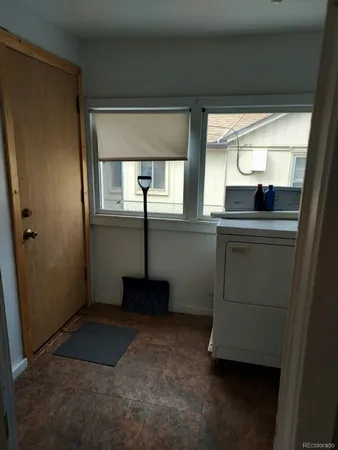 a kitchen with a sink and a refrigerator