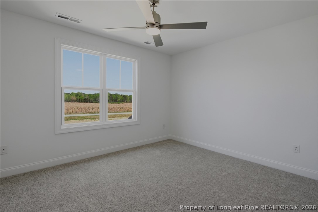 3187 Leaflet Church Road Broadway, NC 27505 - Photo 15 of 27 a view of an empty room with a window