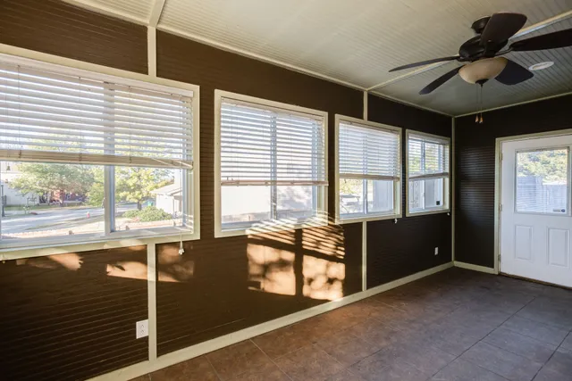 a living room with large windows