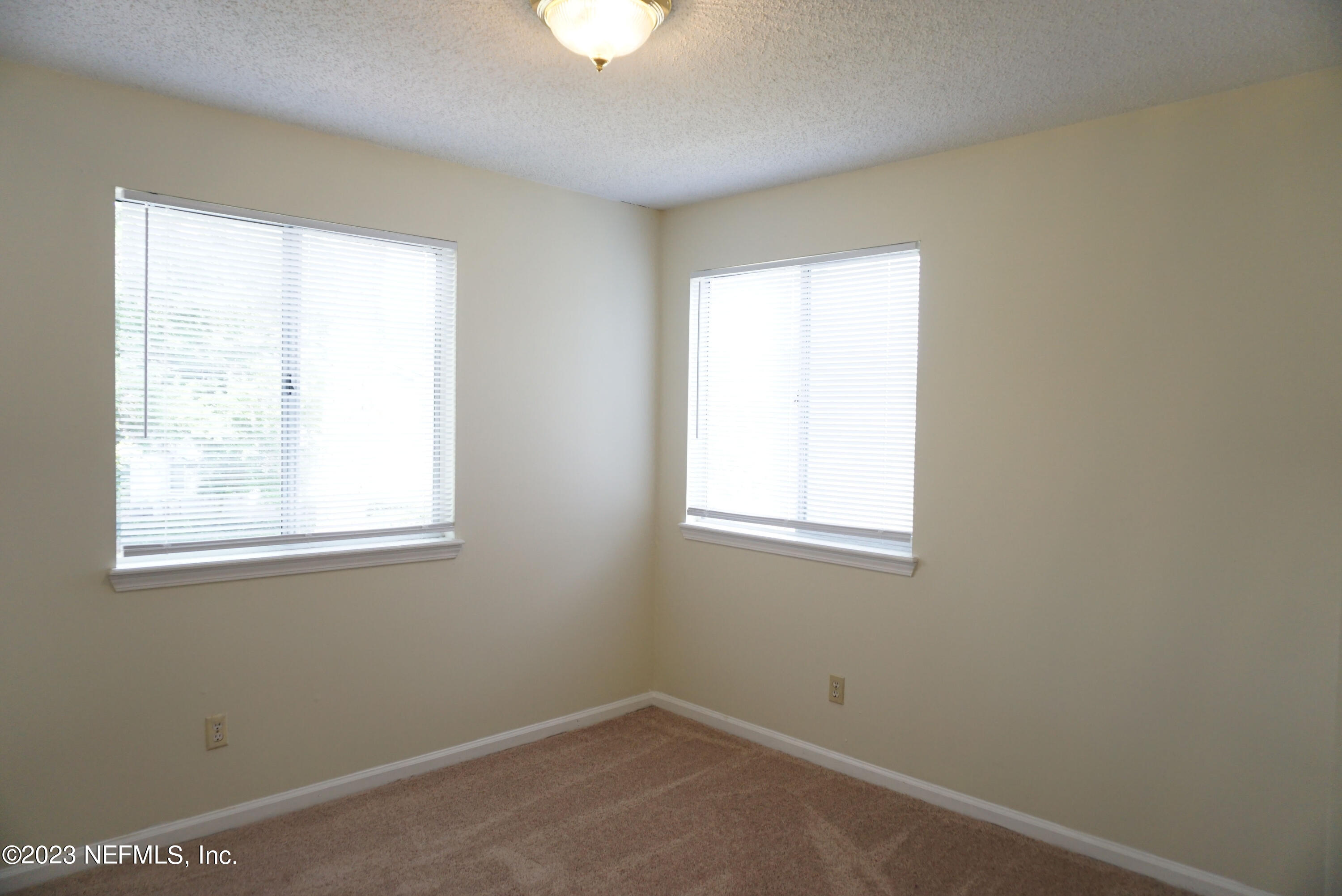 3270 Ricky Drive, Unit 803 Jacksonville, FL 32223 - Photo 13 of 16 an empty room with a window