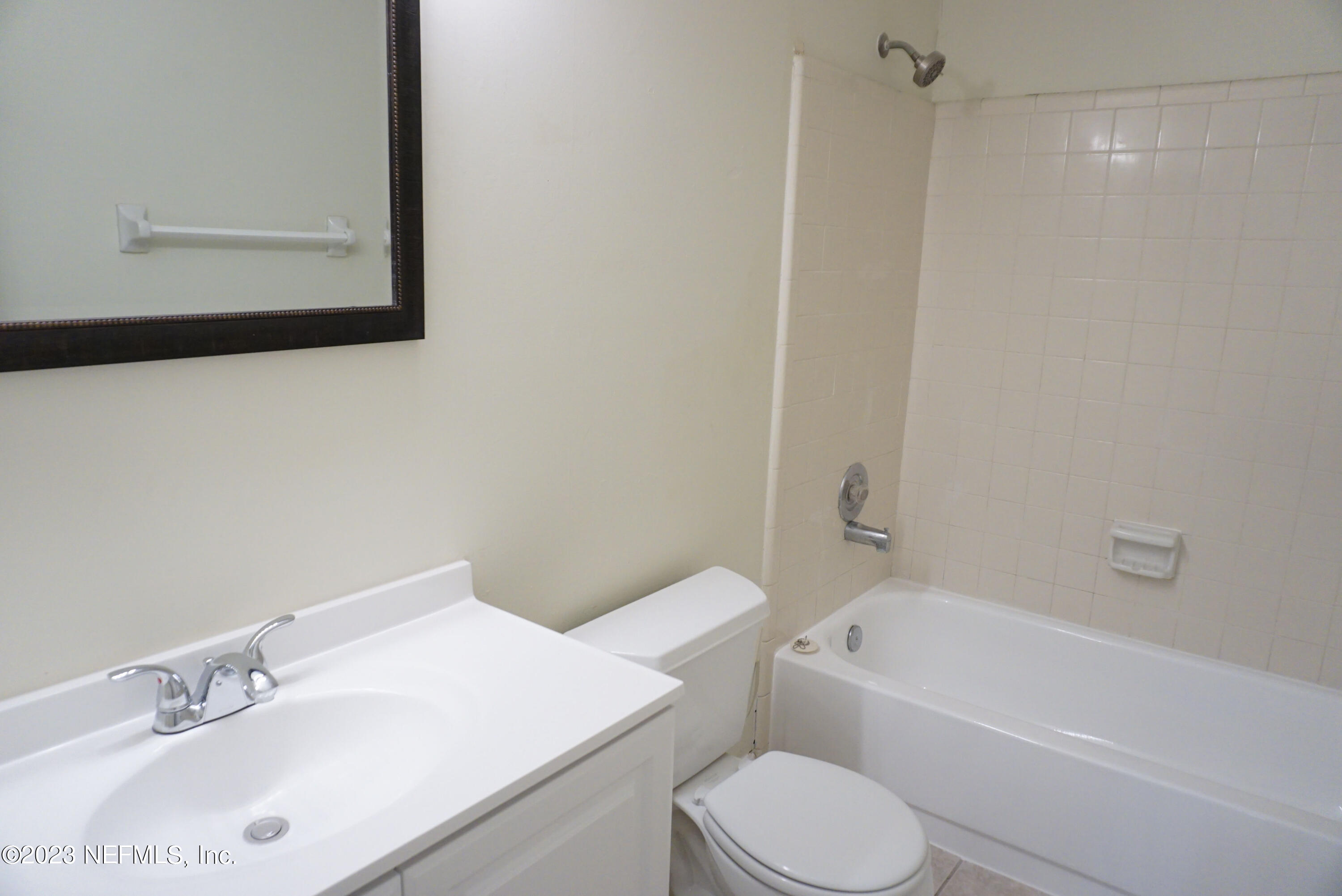 3270 Ricky Drive, Unit 803 Jacksonville, FL 32223 - Photo 14 of 16 a bathroom with a sink toilet and bathtub