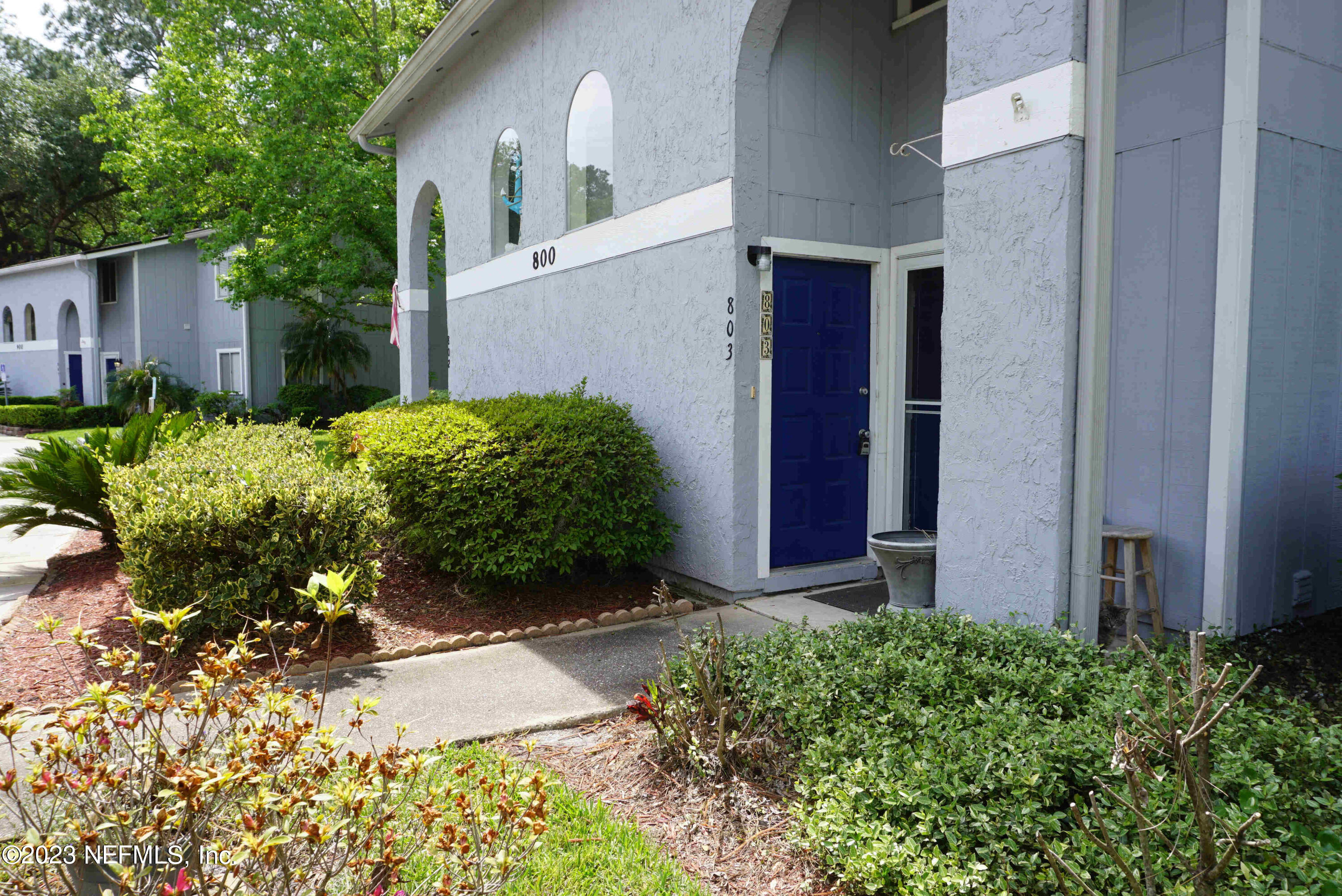 3270 Ricky Drive, Unit 803 Jacksonville, FL 32223 - Photo 2 of 16 a front view of a house with a yard