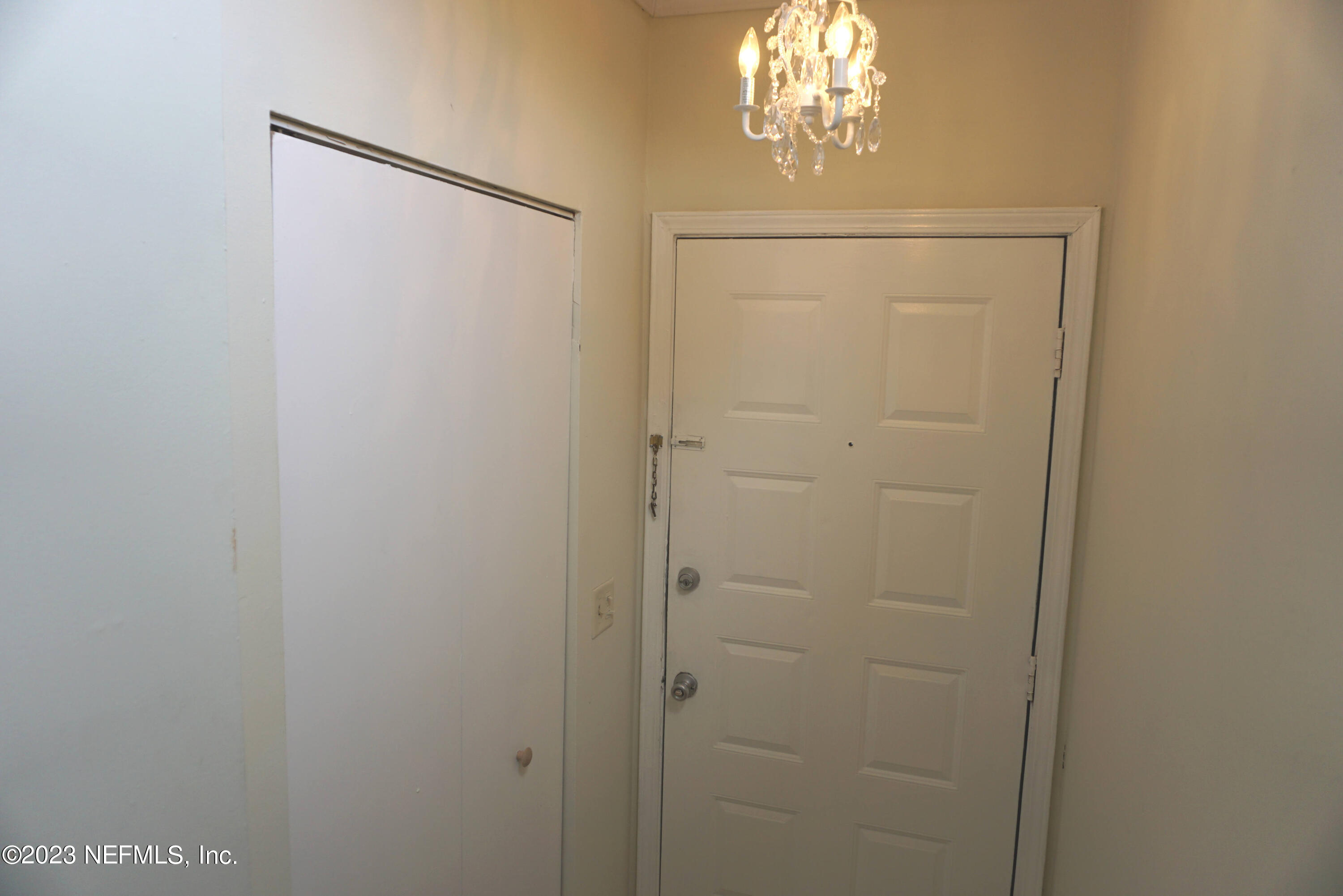3270 Ricky Drive, Unit 803 Jacksonville, FL 32223 - Photo 3 of 16 a bathroom with a chandelier fan