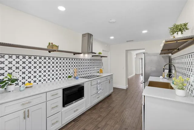 a kitchen with a sink and a microwave